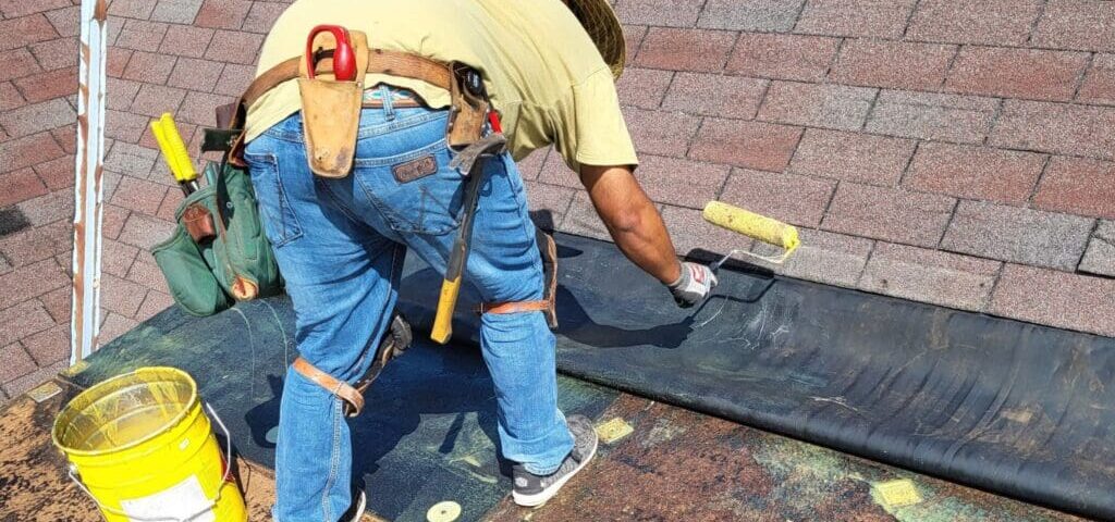Man repairing flat roof