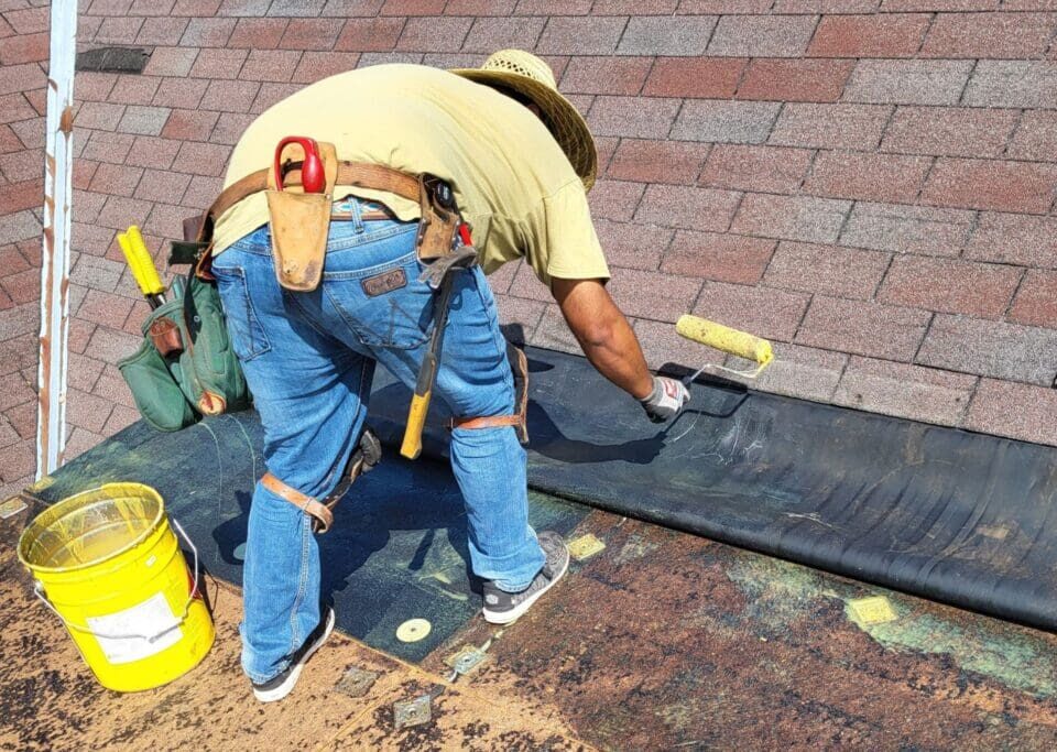 Man repairing flat roof